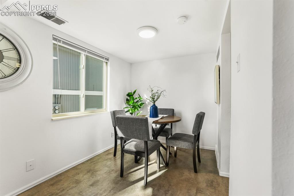 Image 7 of 28: The Dining Area has a large view window that fills the room with lots of na