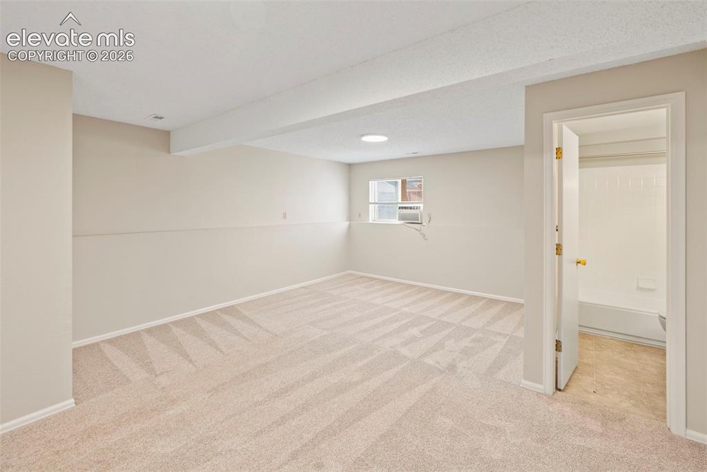 Image 28 of 38: Lower Level Family Room