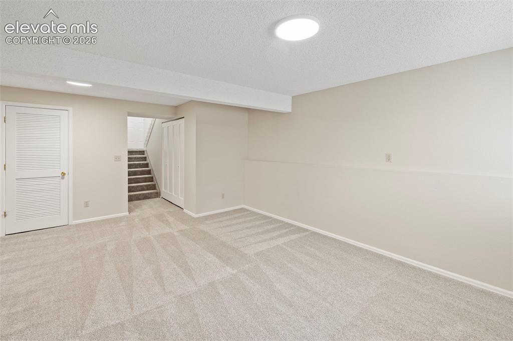 Image 29 of 38: Lower Level Family Room