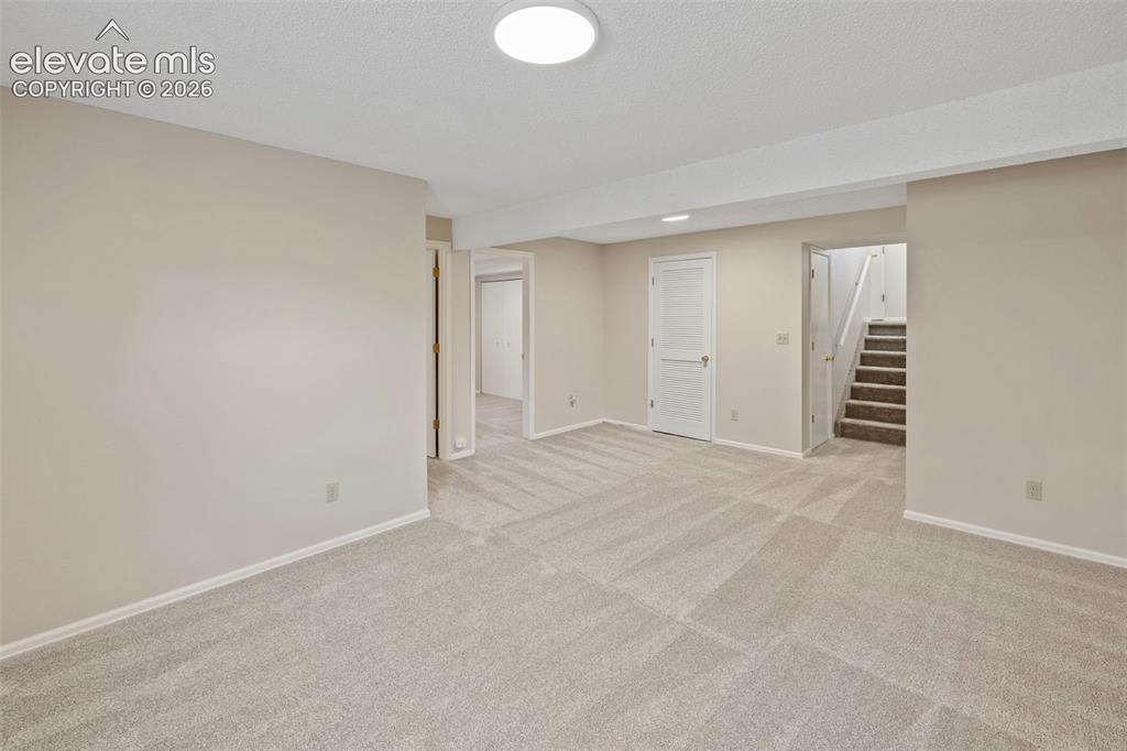 Image 30 of 38: Lower Level Family Room
