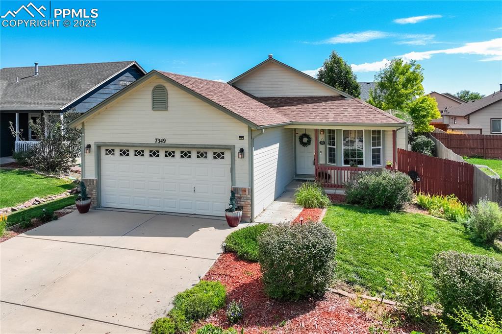 Caption: Timeless curb appeal with mature landscaping + welcoming front entry.