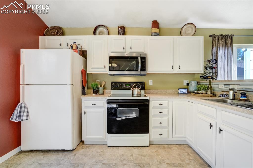 Image 13 of 50: Ample prep + storage space ideal for everyday living + entertaining.

