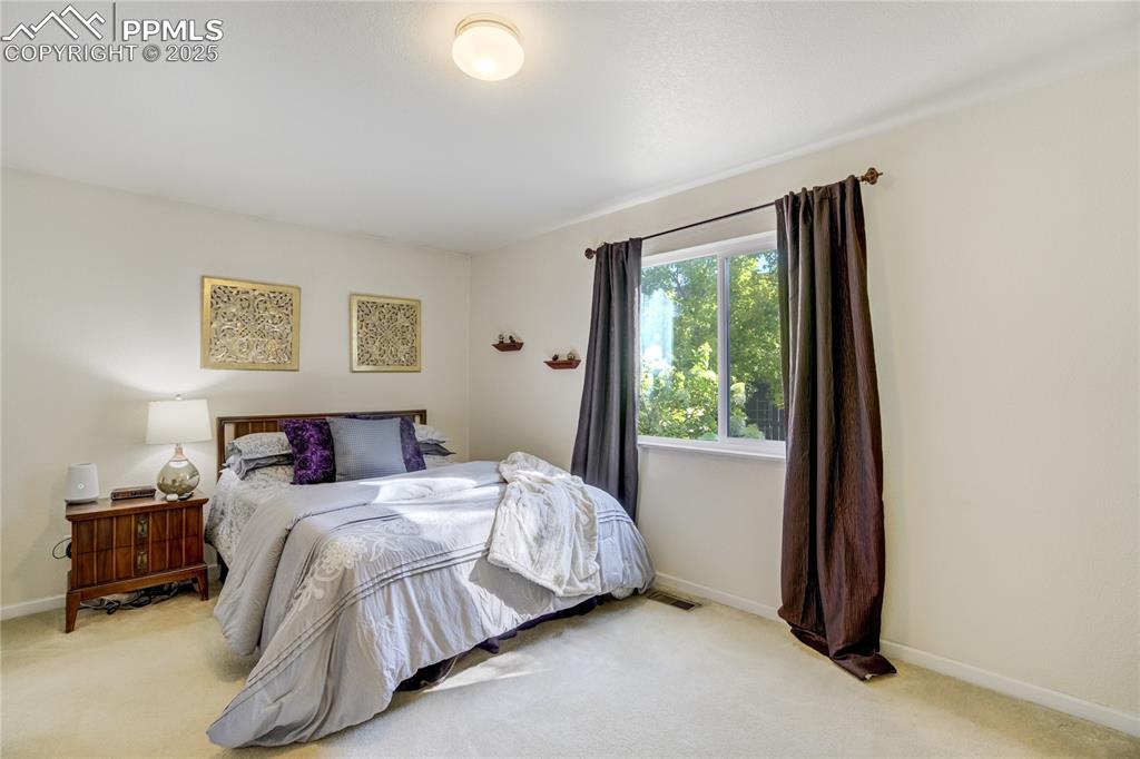 Image 20 of 50: One of 2 Owner’s suite retreat with direct bath access for ease + privacy.