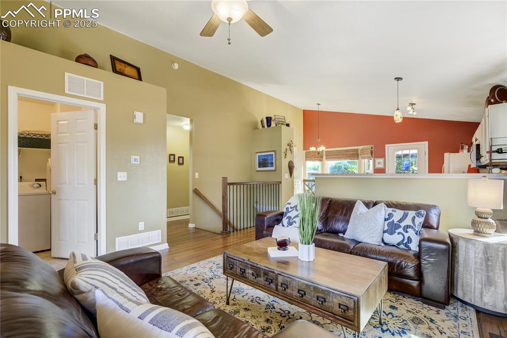 Image 9 of 50: Updated bamboo wood floors expand through the great room and hallway