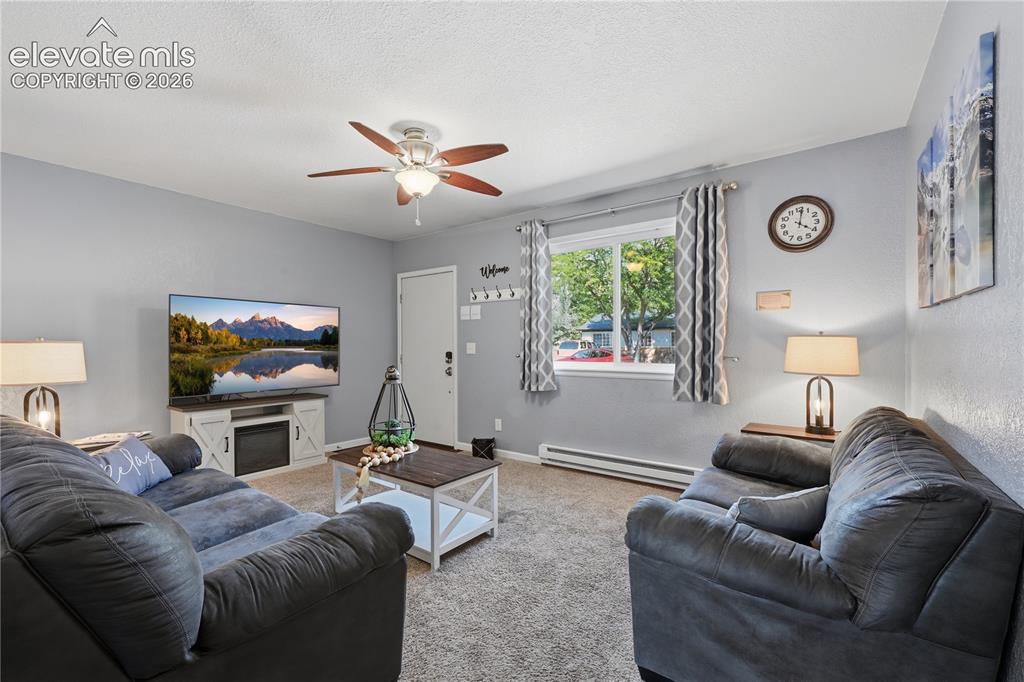 Image 18 of 27: Another view of the Living area and entry.