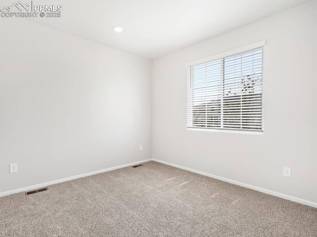 Image 10 of 19: Spare room featuring carpet floors and recessed lighting