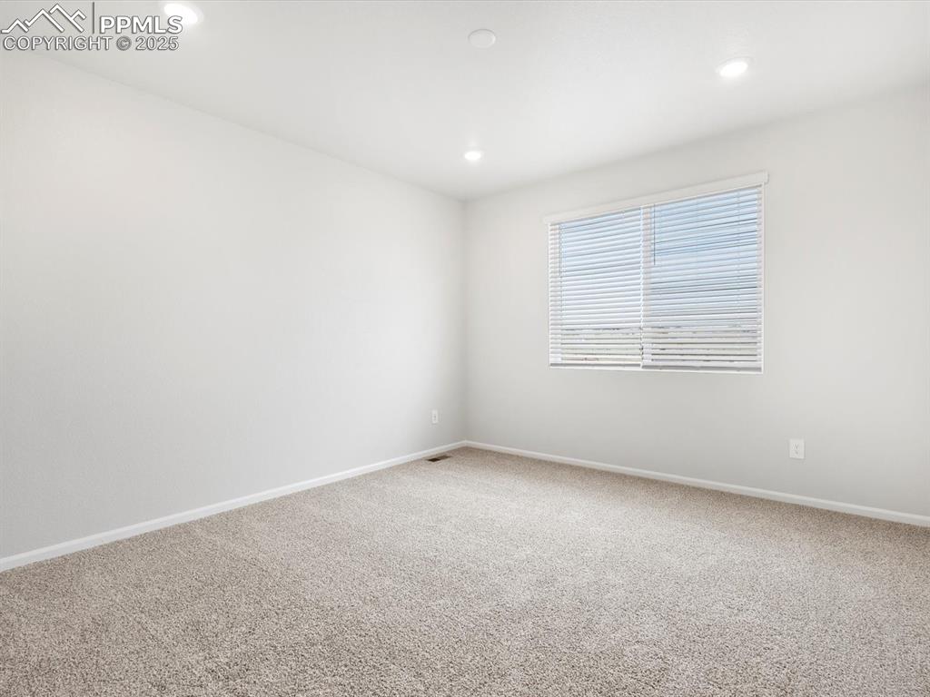 Image 14 of 19: Unfurnished room featuring carpet and recessed lighting