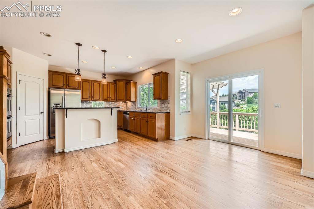 Image 10 of 48: Spacious breakfast nook, walks out to main level deck