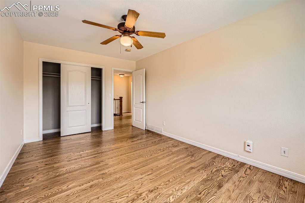 Image 31 of 48: Upper level secondary bedroom with closet
