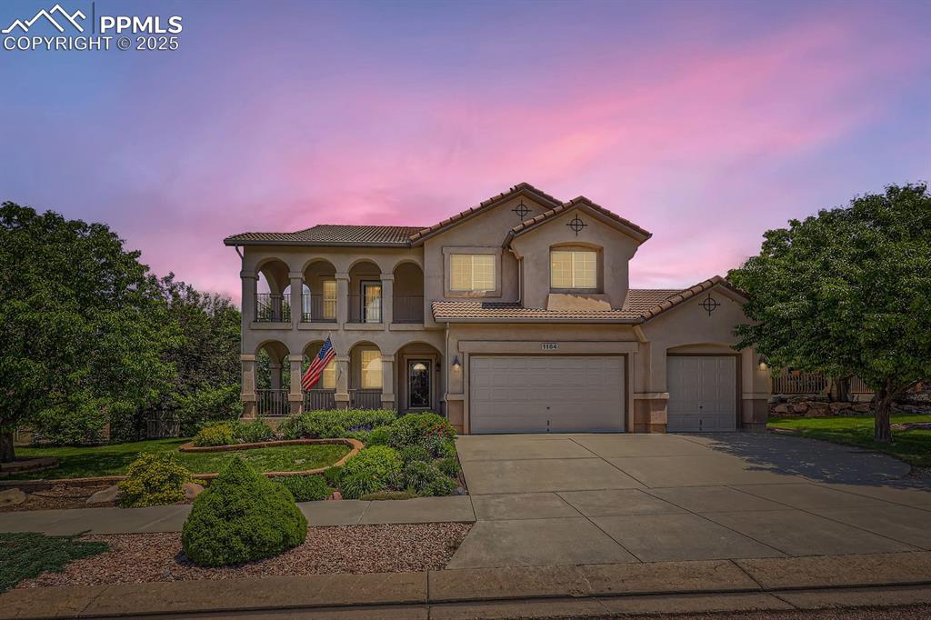 Image 48 of 48: Twilight front elevation