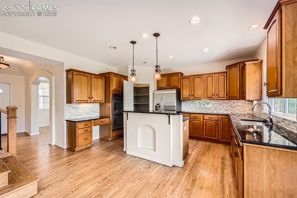 Image 5 of 48: Entry, kitchen with planning desk