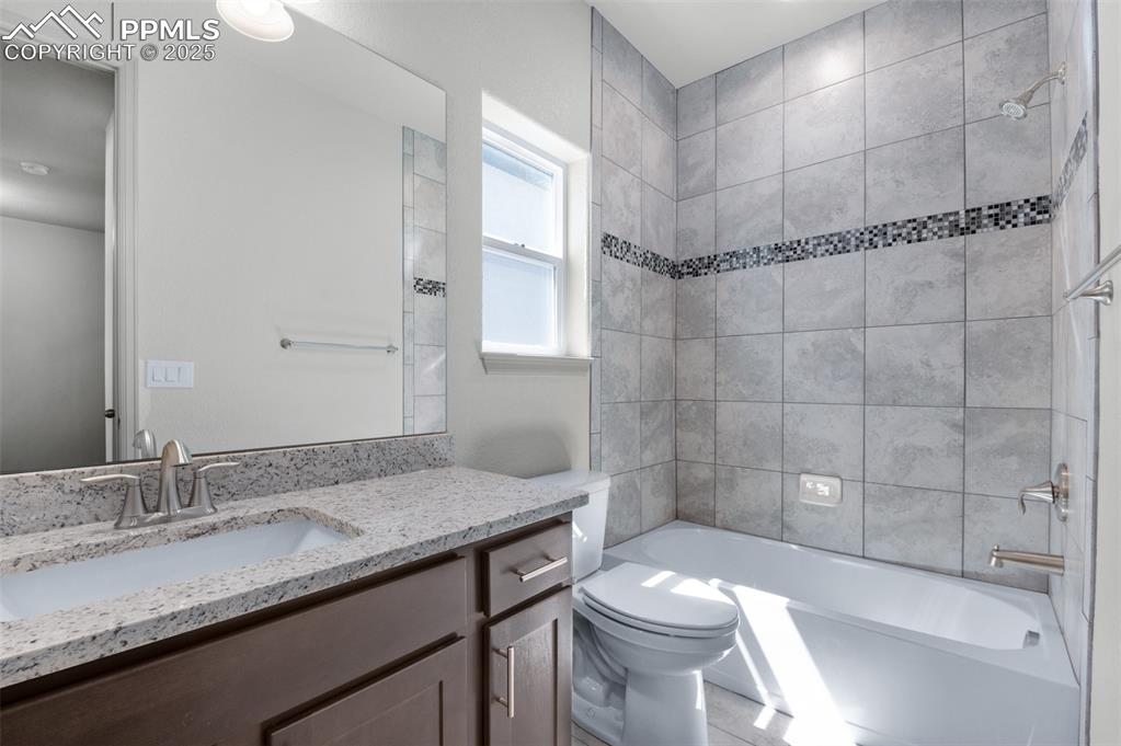 Image 4 of 21: Full bath with bathtub / shower combination and vanity
