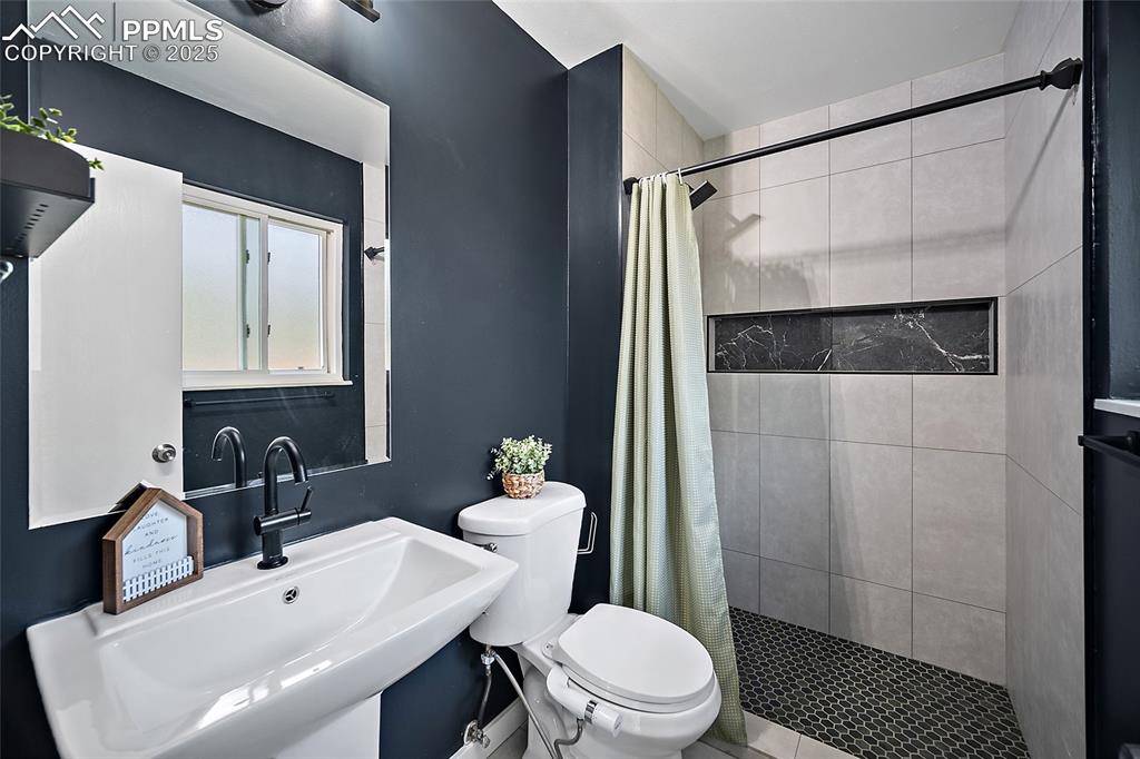 Image 21 of 38: Master bathroom with a modern style shower