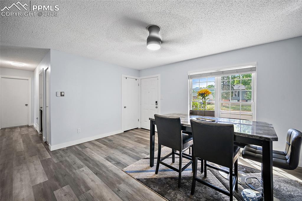 Image 5 of 38: Family room featuring a ceiling fan and LVP flooring