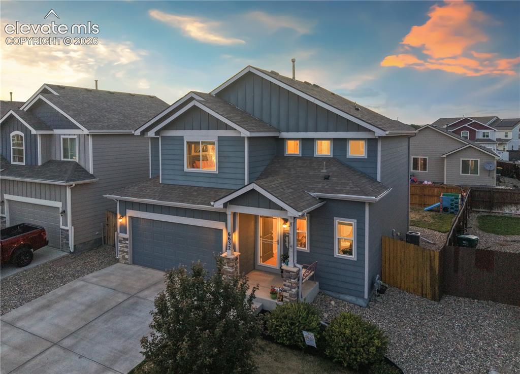 Image 2 of 43: Two-story residence featuring a blue siding exterior with white trim accent