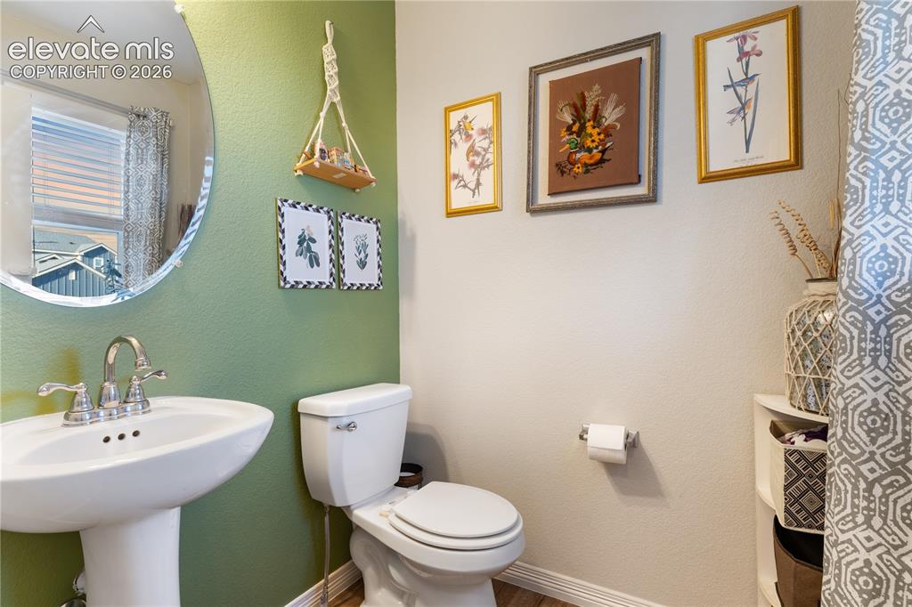 Image 23 of 43: Guest 1/2 bath off hallway entrance 