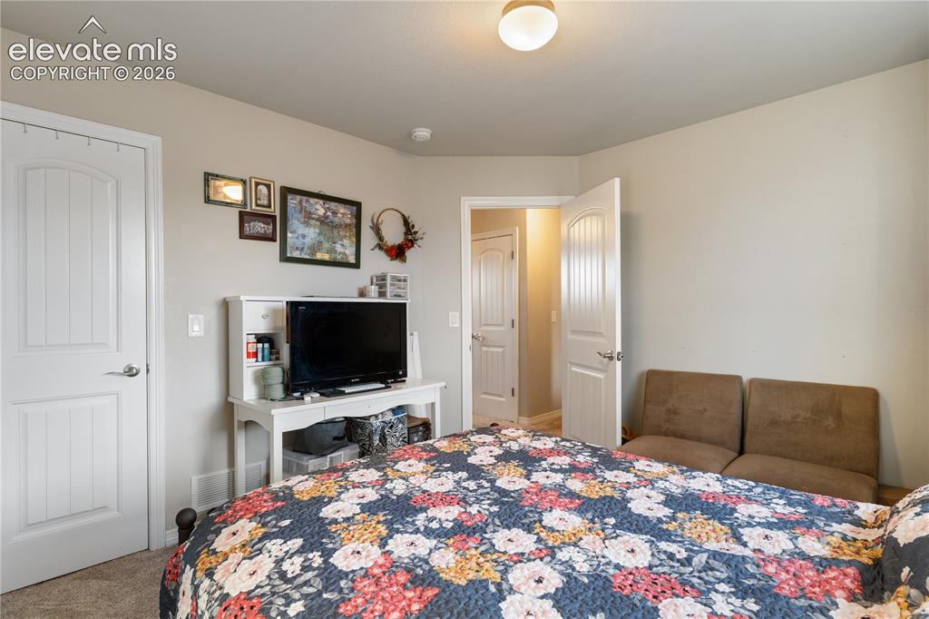 Image 33 of 43: both secondary closets feature walk in closets and overlook back yard