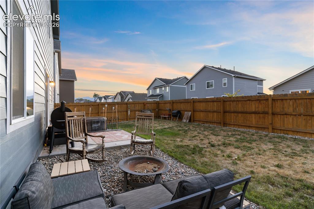 Image 39 of 43: Spacious yard and patio area to enjoy the evenings