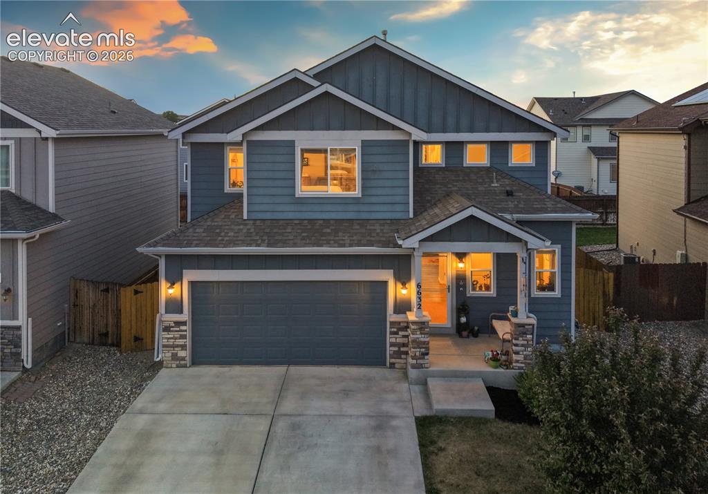 Image 5 of 43: Contemporary two-story residence with a two-car garage