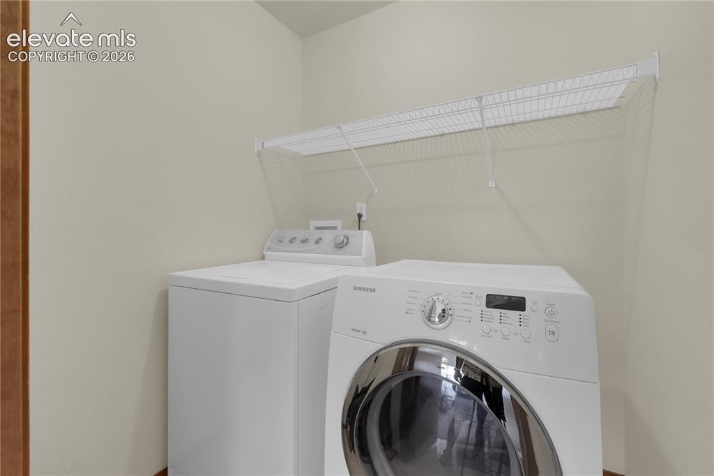 Image 10 of 27: Main level laundry room.