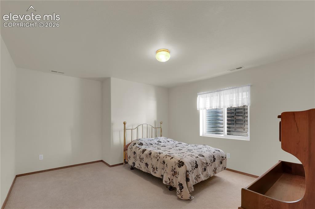 Image 17 of 27: Basement bedroom -1