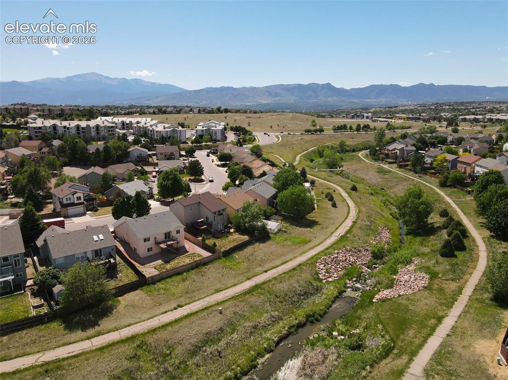 Image 4 of 27: Great open area behind the home and the Homestead trail.