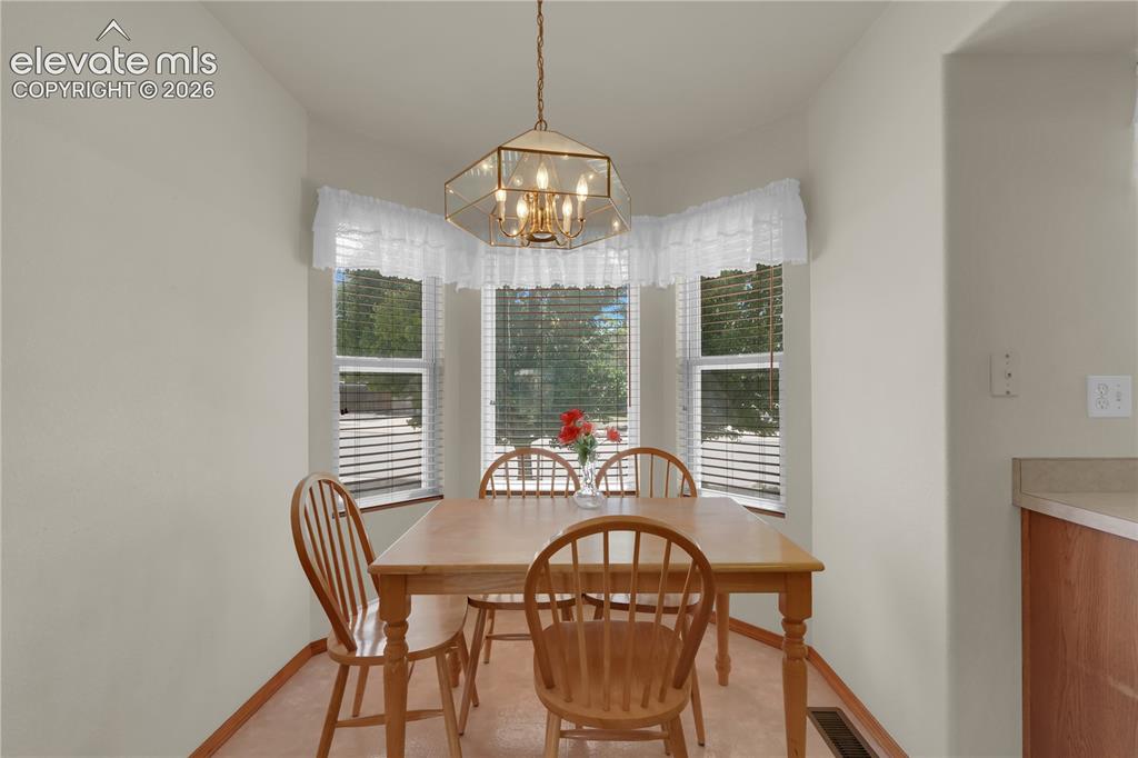 Image 7 of 27: Bright eat-in kitchen area