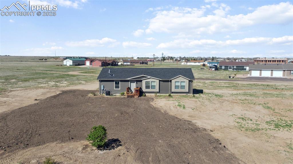 Image 11 of 34: Manufactured / mobile home with dirt driveway
