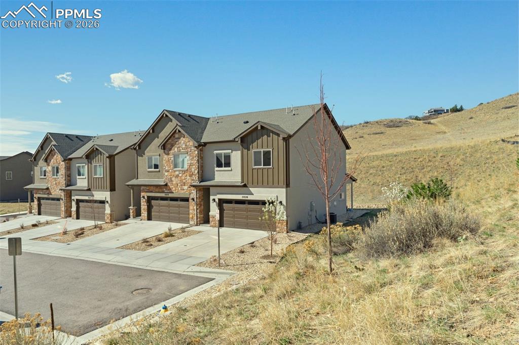 Caption: End unit home surrounded by open space