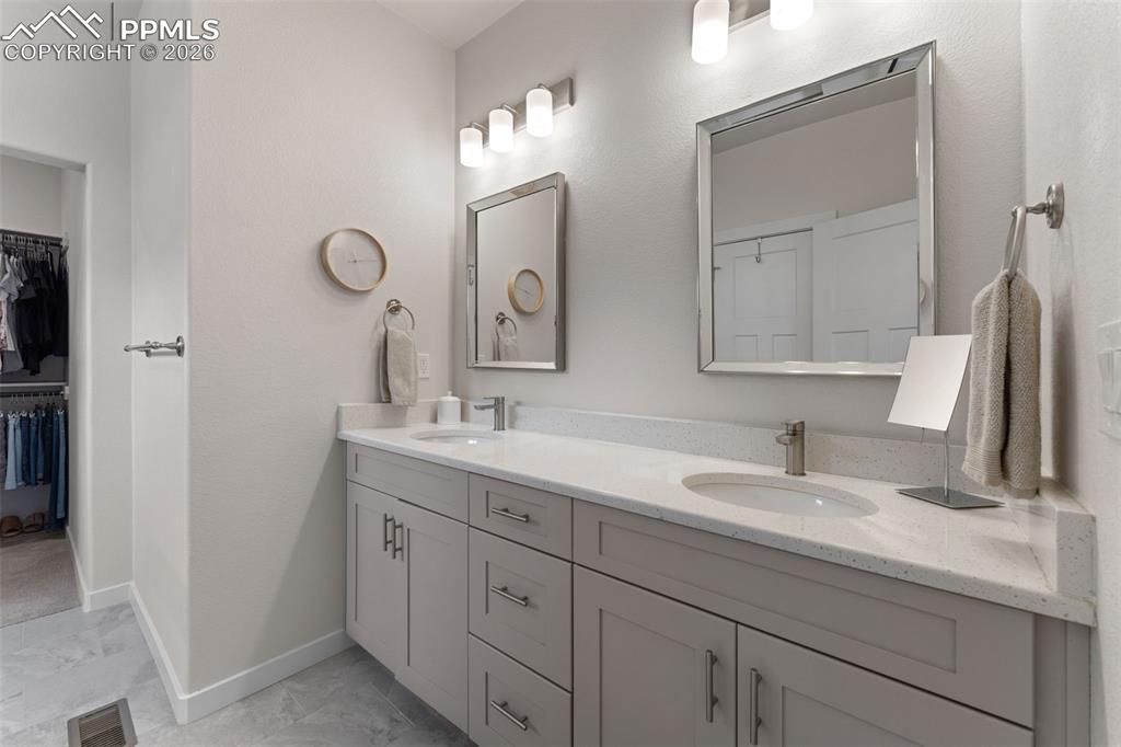 Image 19 of 42: Primary bathroom with dual sinks