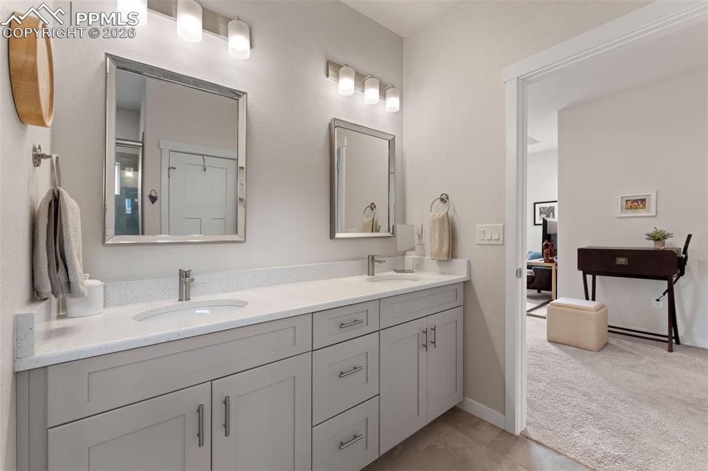 Image 21 of 42: Lots of light and space in the primary bathroom