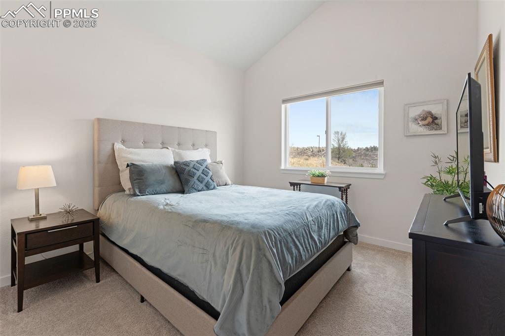 Image 25 of 42: Third bedroom has windows facing Ute Valley Park