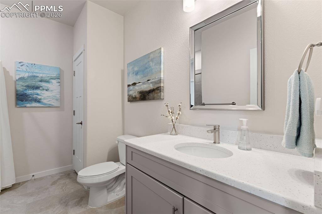 Image 27 of 42: Second bathroom has plenty of space and a linen closet