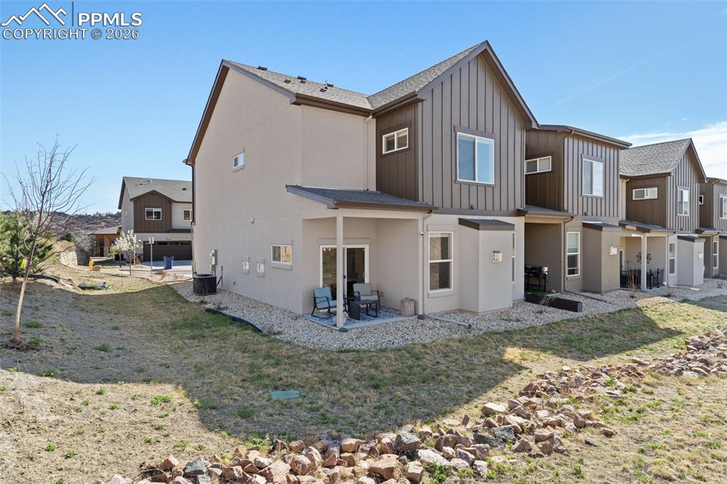 Image 34 of 42: Corner covered patio surrounded by open space