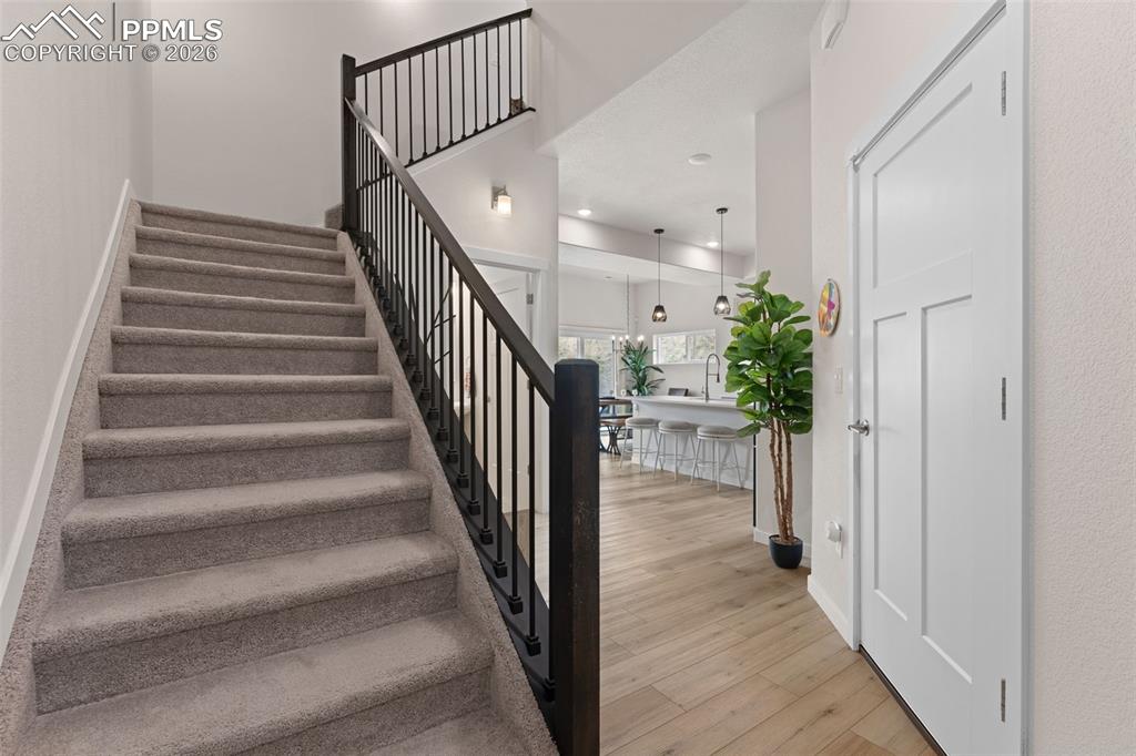 Image 4 of 42: Two-story entry entry with lots of light