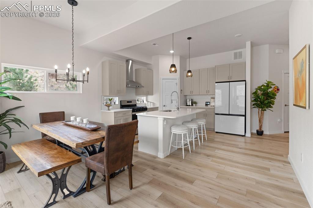 Image 6 of 42: Dining area connects to kitchen and living room