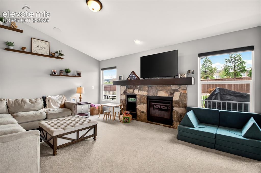 Image 10 of 41: Living room and gas fireplace