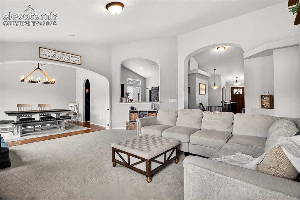 Image 11 of 41: Living room toward dining room