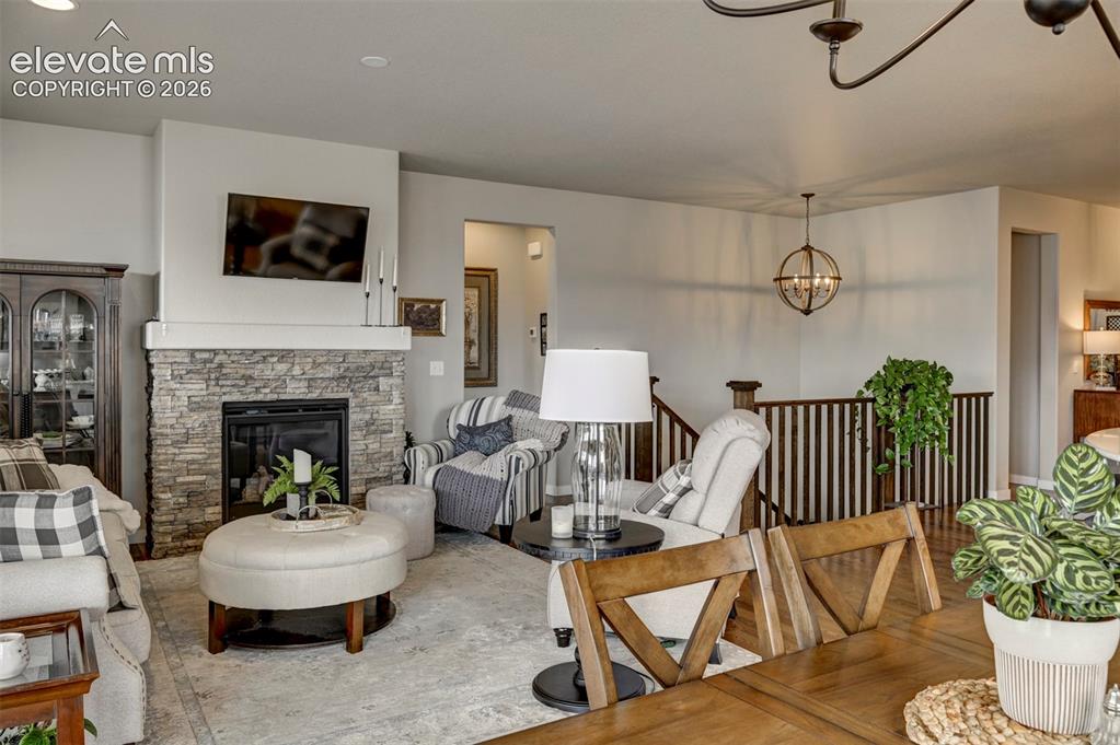Image 13 of 29: Stacked stone fireplace with a substantial hearth, built-in television moun