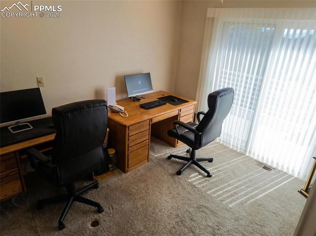 Image 12 of 30: Office featuring light colored carpet