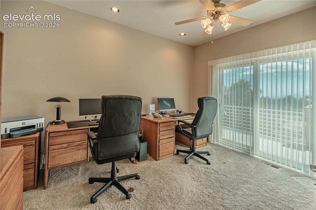 Image 29 of 50: Carpeted room featuring a ceiling fan with integrated lighting, recessed li