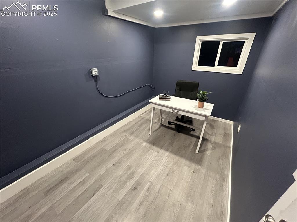 Image 31 of 46: Office area featuring light wood-type flooring and baseboards