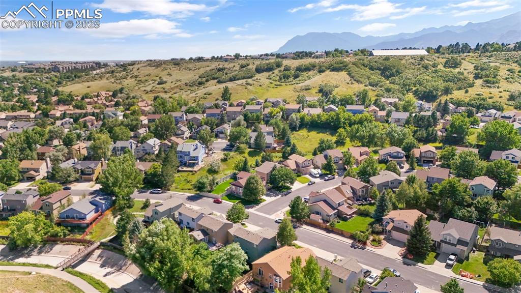 Image 39 of 46: Aerial perspective of suburban area featuring mountains