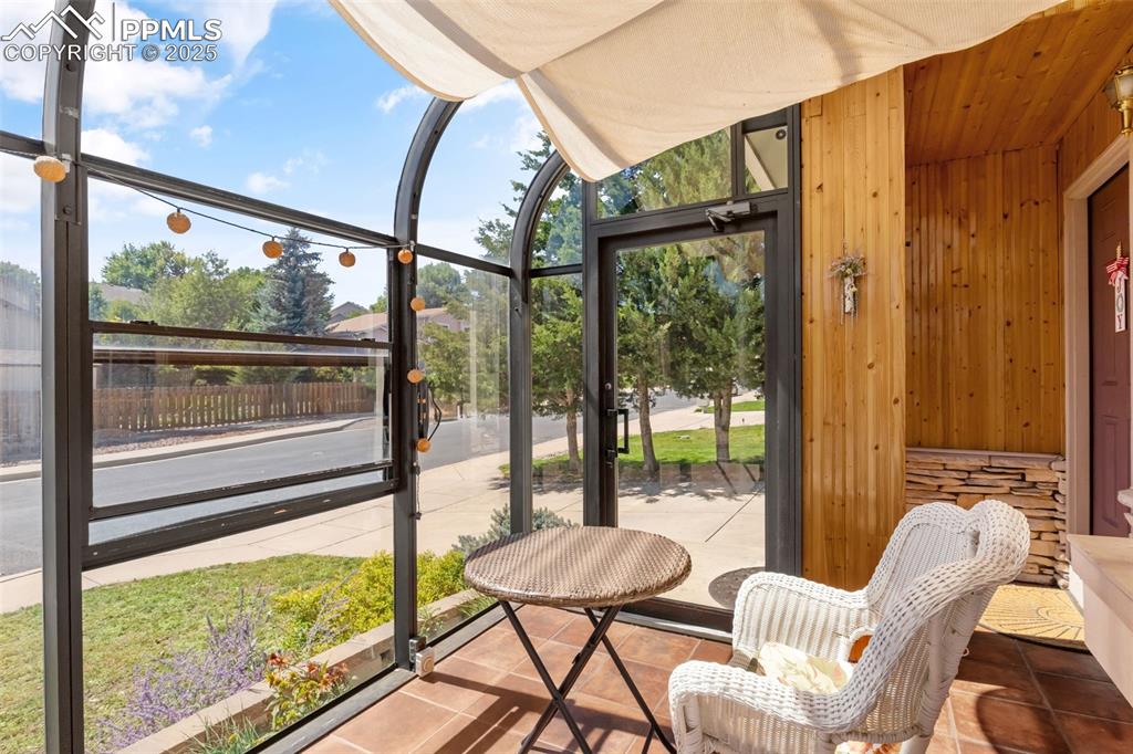 Image 45 of 46: Sunroom with a patio