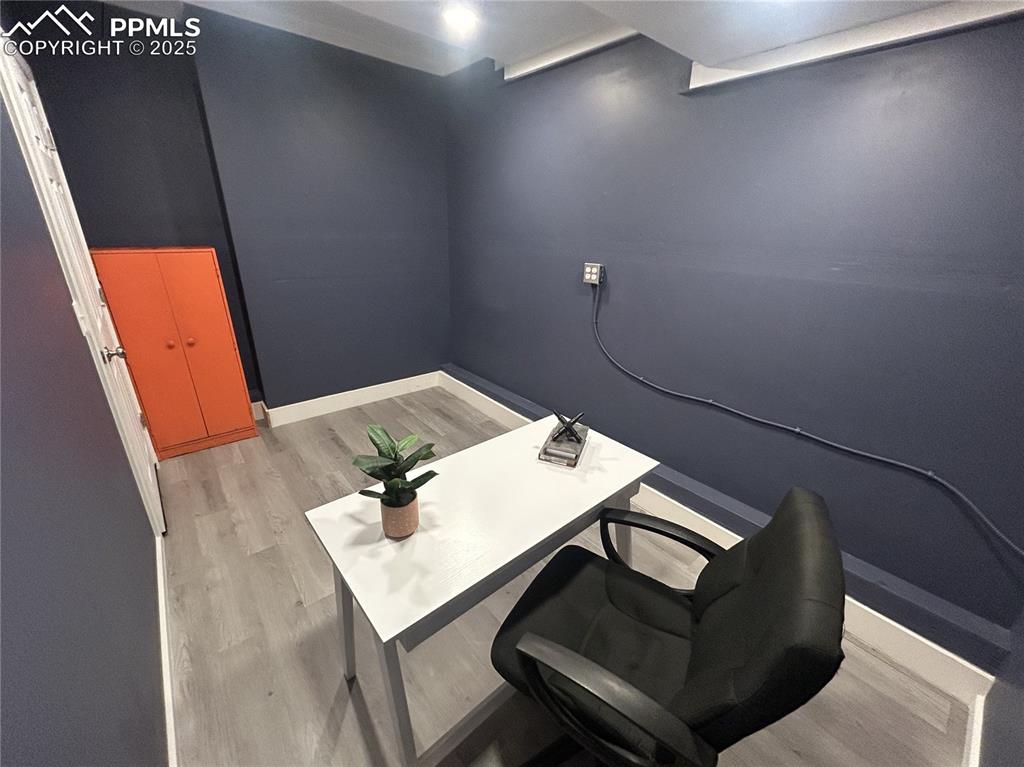 Image 46 of 46: Office area featuring light wood-style flooring and baseboards