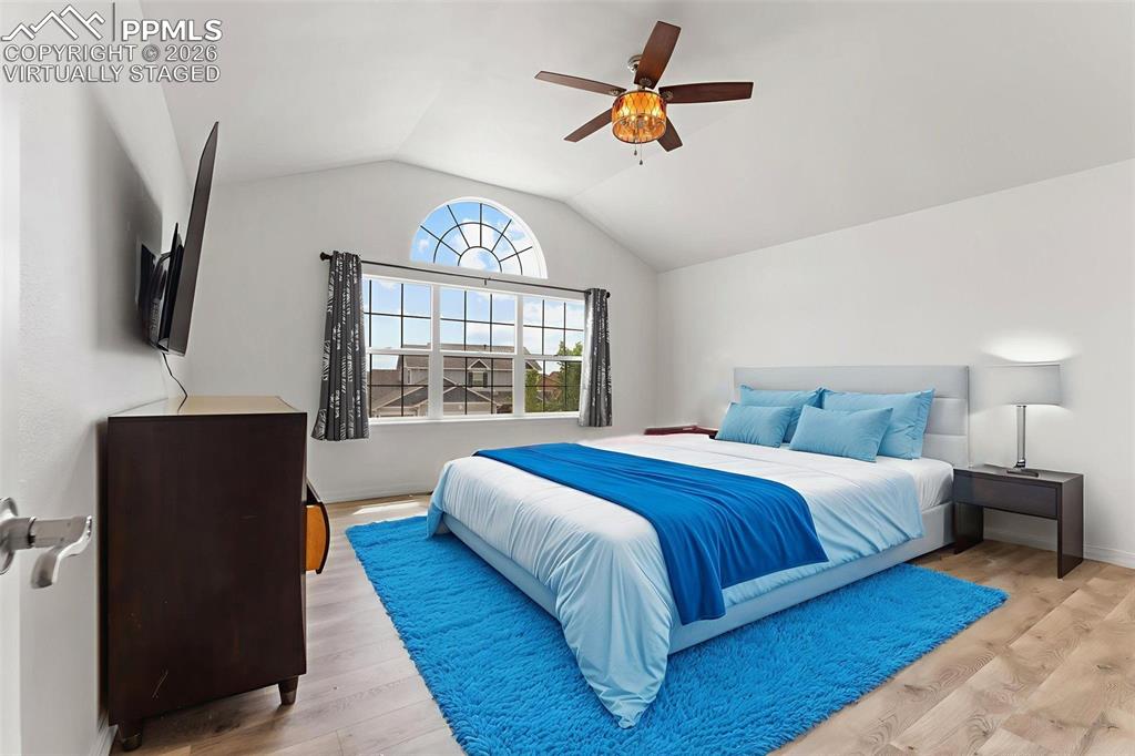 Image 18 of 50: Primary Bedroom with Vaulted Ceiling, French Doors for En-suite and Walk-In