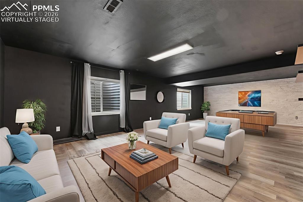 Image 32 of 50: Basement Level Family Room; virtually staged *