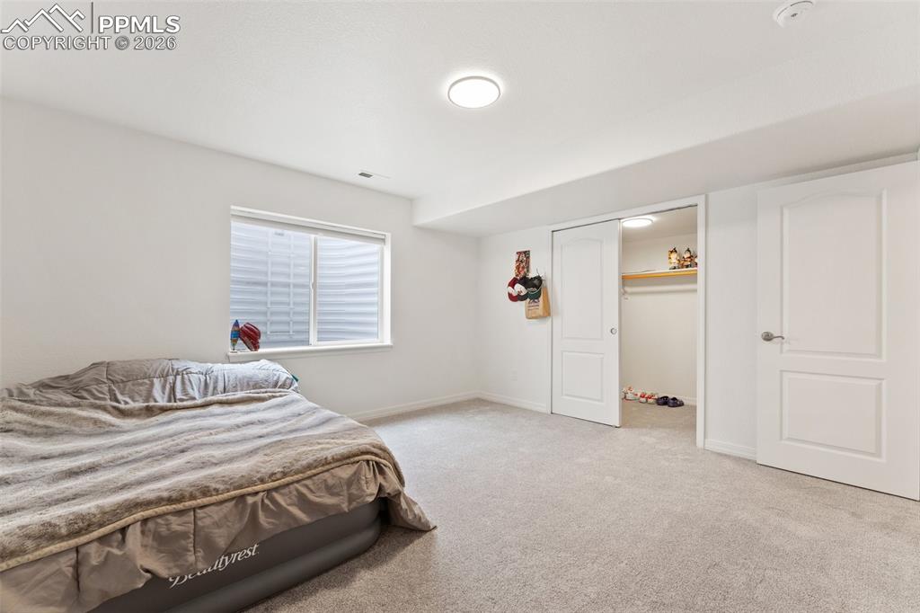 Image 38 of 50: Basement Bedroom #5; with Oversized Walk-in Closet