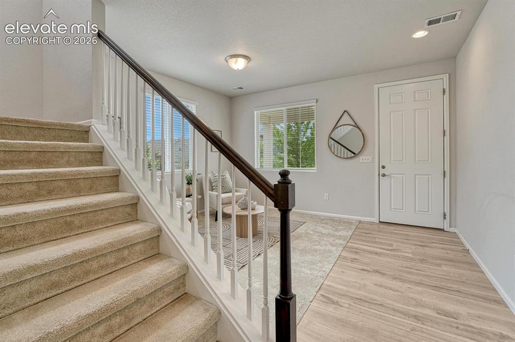Image 10 of 50: Formal Living Room with front yard views.