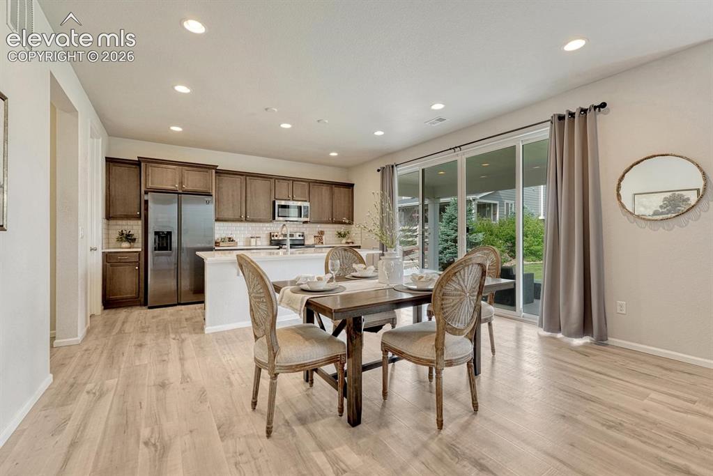 Image 16 of 50: View of the Family Room from the Dining Area.